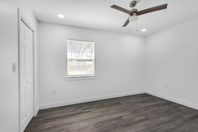 unfurnished bedroom with a closet, dark hardwood / wood-style floors, and ceiling fan