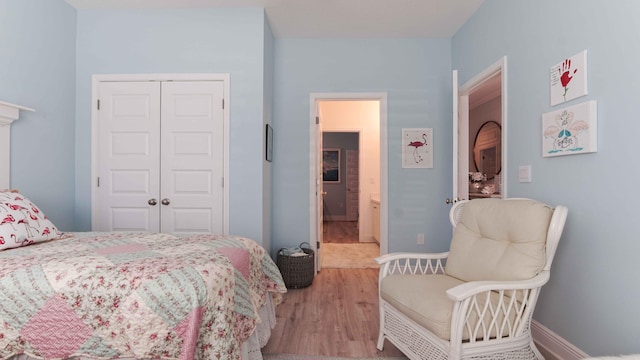 bedroom featuring a closet and light hardwood / wood-style floors