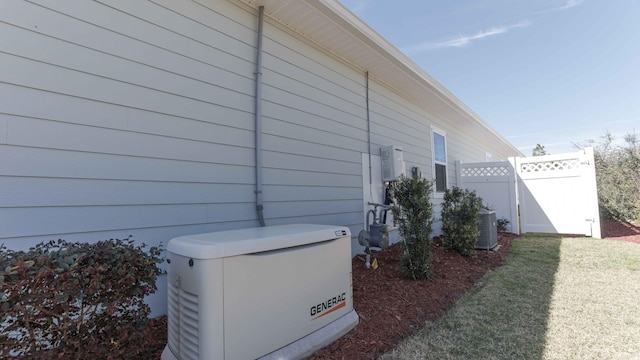 view of side of property with central air condition unit