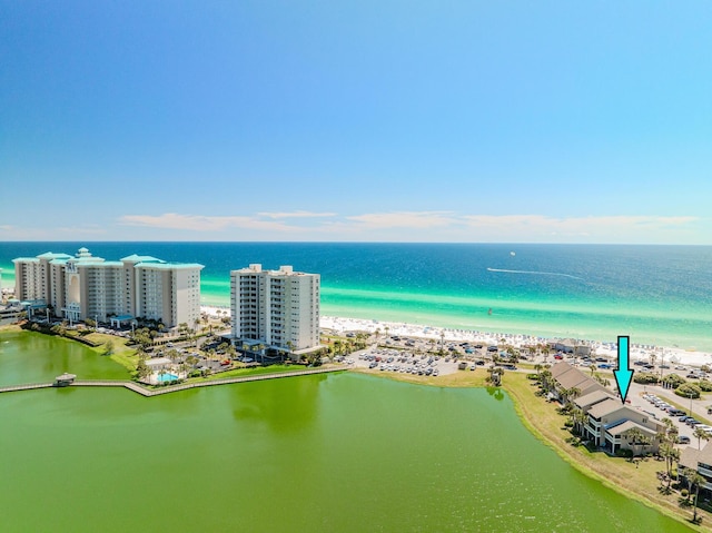 birds eye view of property featuring a view of the beach and a water view