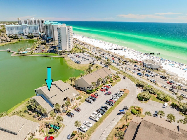 bird's eye view featuring a view of the beach and a water view