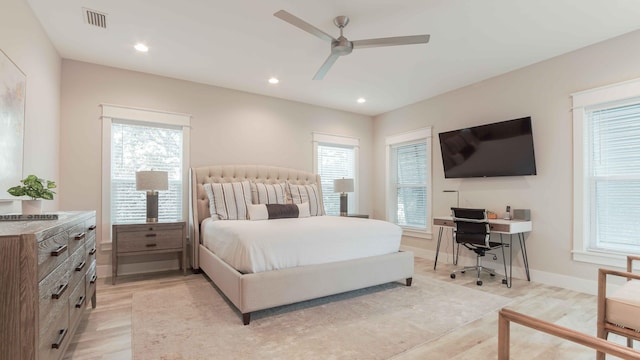 bedroom with ceiling fan and light wood-type flooring