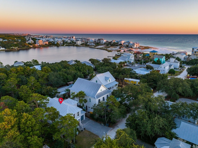 aerial view at dusk with a water view