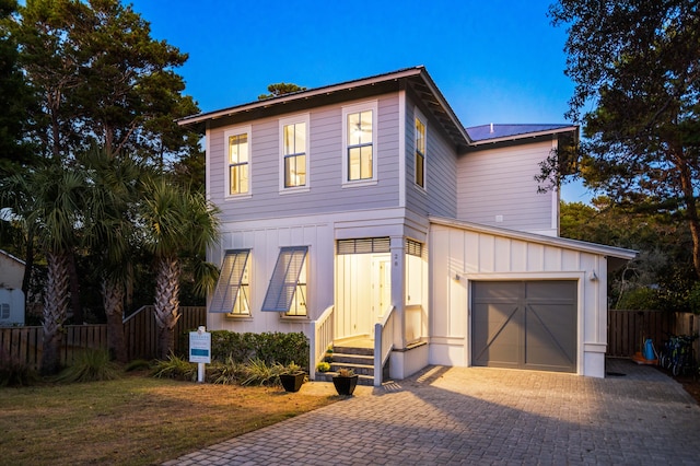 view of front of property featuring a garage