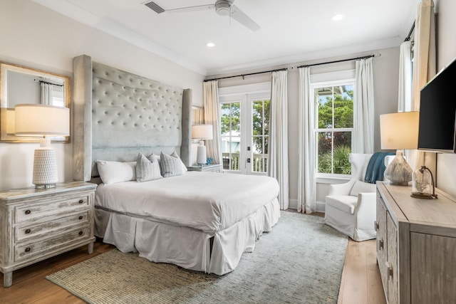 bedroom with access to outside, french doors, ceiling fan, and hardwood / wood-style floors