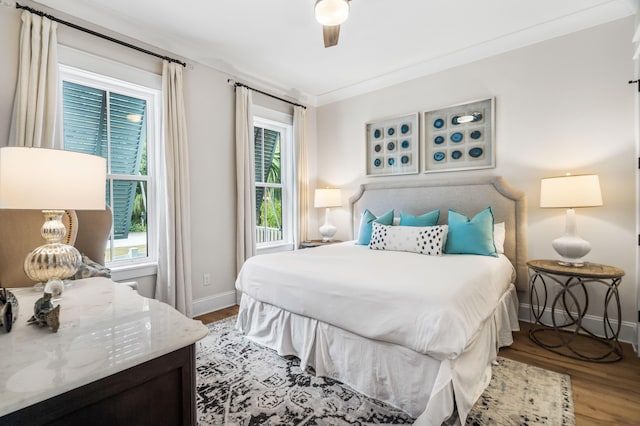 bedroom with crown molding, ceiling fan, and light wood-type flooring