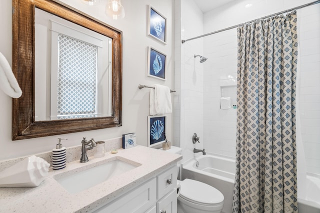 full bathroom featuring shower / bathtub combination with curtain, toilet, and vanity