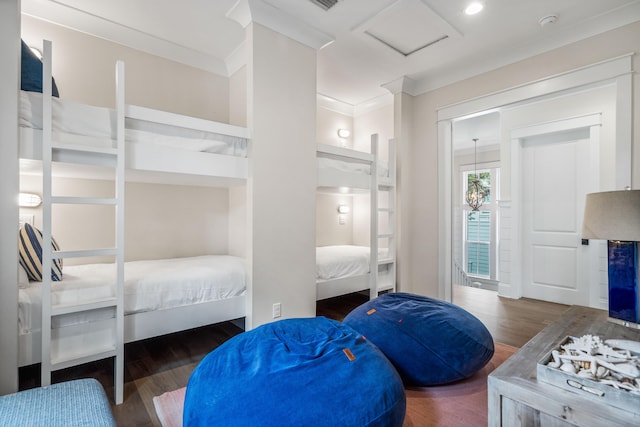 bedroom featuring ornamental molding and dark hardwood / wood-style floors