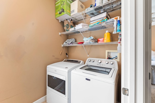 clothes washing area featuring washer hookup and washer and dryer