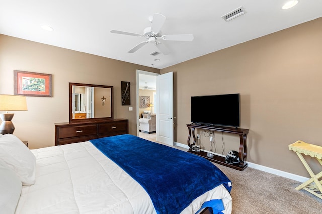 bedroom featuring ceiling fan and carpet