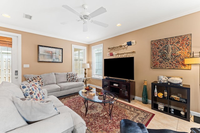 living room with ornamental molding, ceiling fan, and light tile flooring