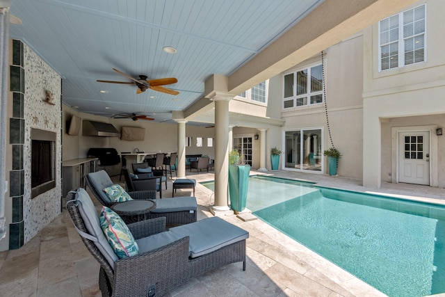 view of pool featuring a patio area, ceiling fan, and an outdoor hangout area