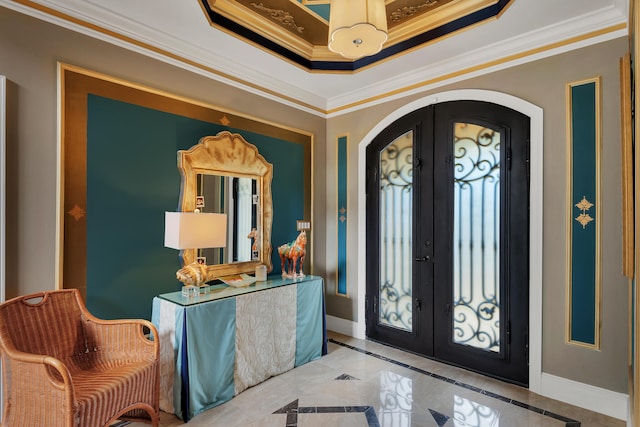 foyer entrance with ornamental molding, french doors, light tile flooring, and a raised ceiling