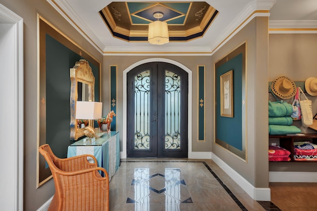 foyer entrance with french doors, crown molding, tile floors, and a tray ceiling