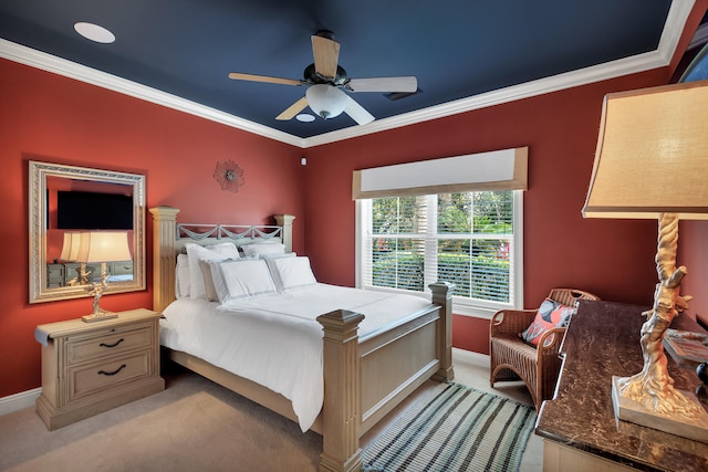 carpeted bedroom with ceiling fan and crown molding