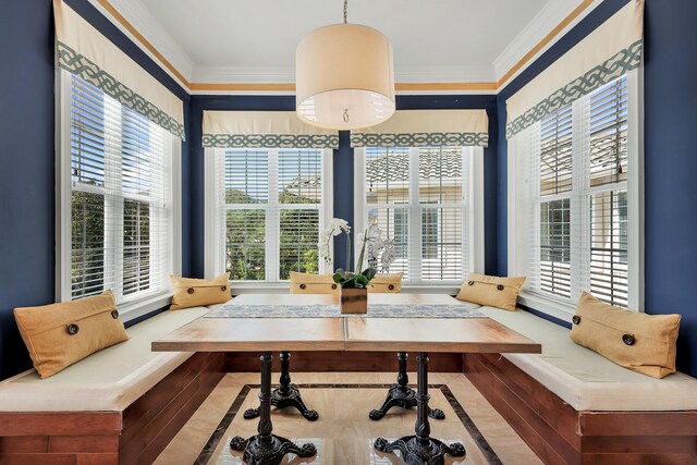 interior space featuring ornamental molding and light hardwood / wood-style floors