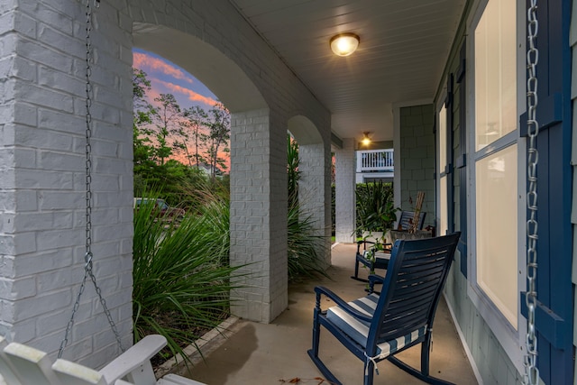 patio terrace at dusk with covered porch