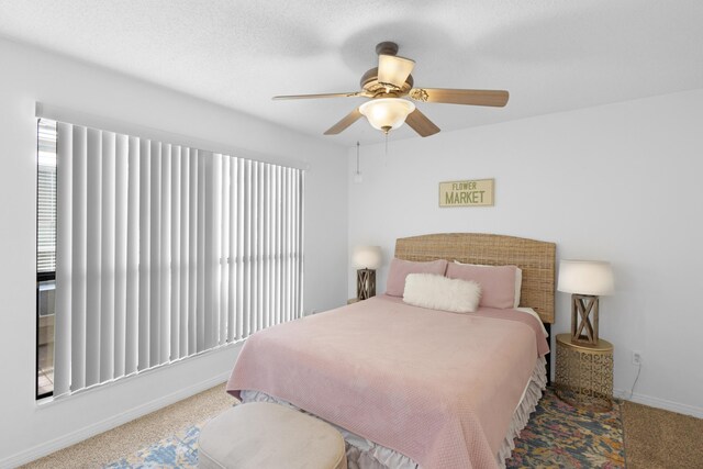 bedroom with ceiling fan and carpet flooring