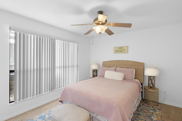 bedroom featuring carpet floors, baseboards, and a ceiling fan