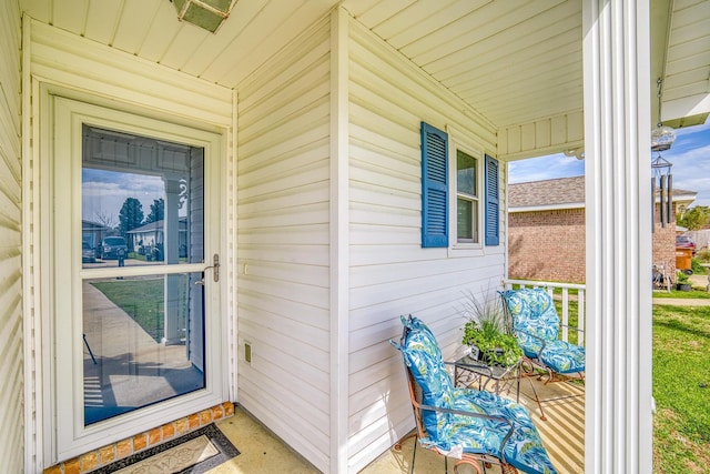 doorway to property with covered porch