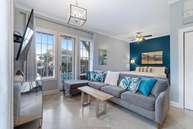 living room featuring ceiling fan with notable chandelier, ornamental molding, and light tile floors