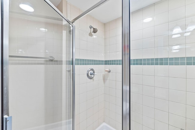 bathroom featuring an enclosed shower