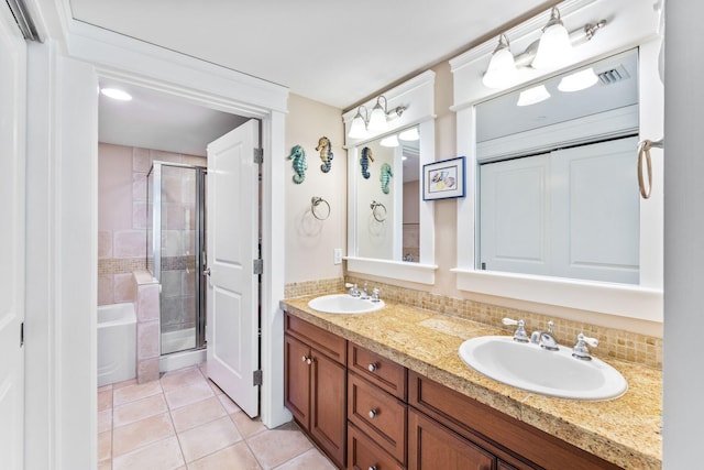 bathroom with vanity, tasteful backsplash, tile patterned floors, and separate shower and tub