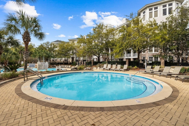 view of swimming pool with a patio area