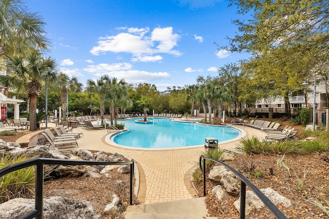 view of swimming pool with a patio