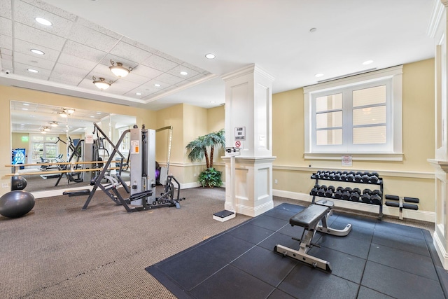 exercise room featuring decorative columns