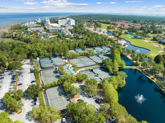 birds eye view of property with a water view