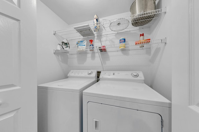 clothes washing area featuring washing machine and dryer