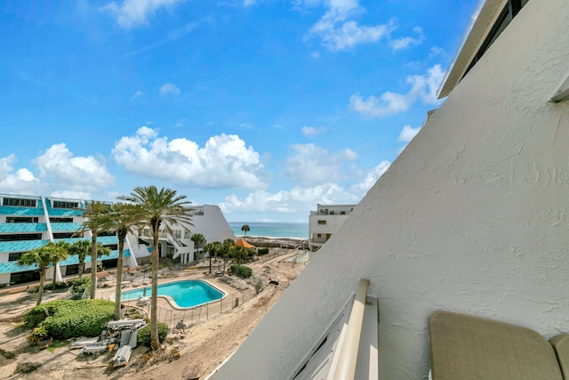 view of pool featuring a water view