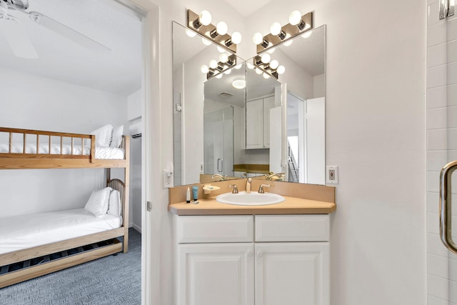 bathroom featuring vanity and a shower