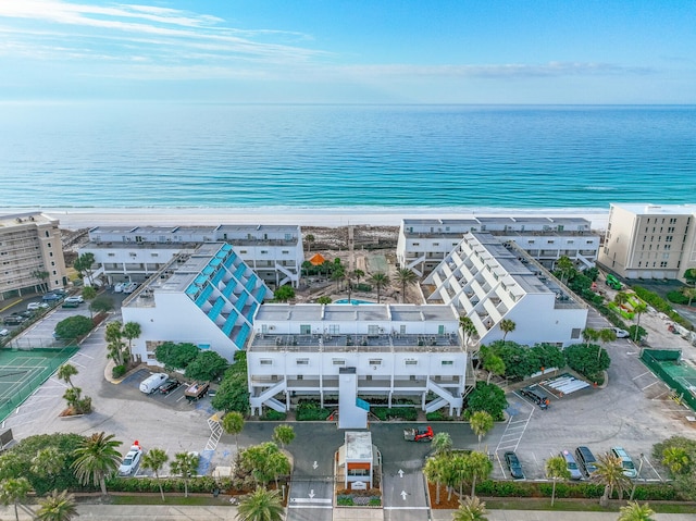 drone / aerial view featuring a view of the beach and a water view