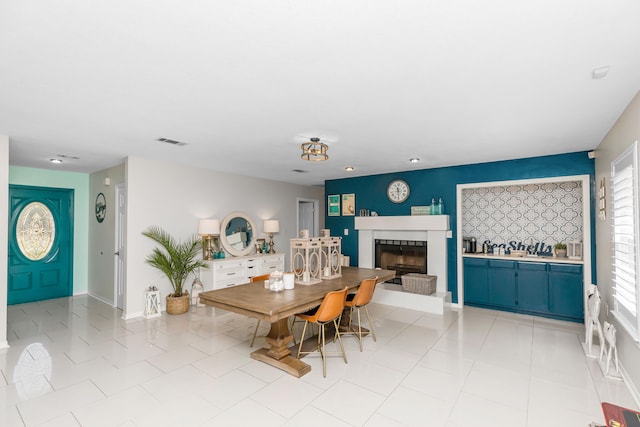 tiled dining room with a wealth of natural light