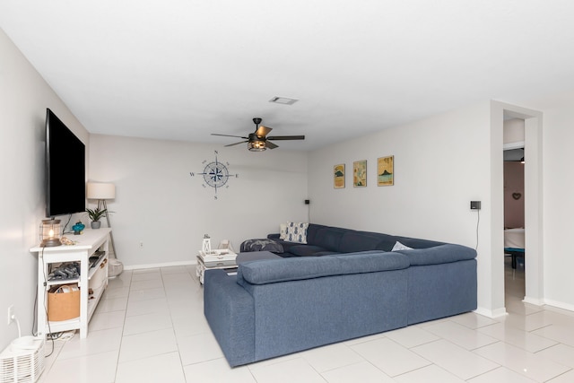 tiled living room with ceiling fan