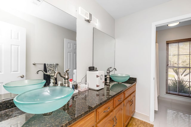 bathroom featuring vanity and tile patterned floors