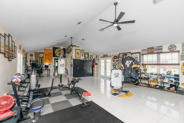 exercise room featuring ceiling fan, light tile patterned floors, vaulted ceiling, and french doors