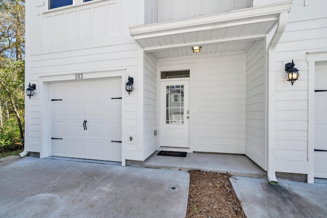 doorway to property featuring a garage