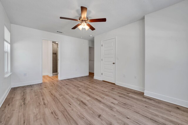 unfurnished room featuring ceiling fan and light wood-type flooring