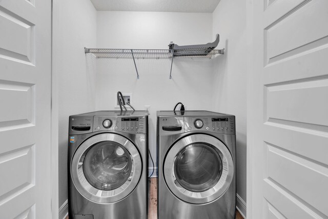 clothes washing area with hookup for a washing machine and washer and clothes dryer