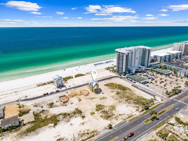 bird's eye view with a water view and a view of the beach