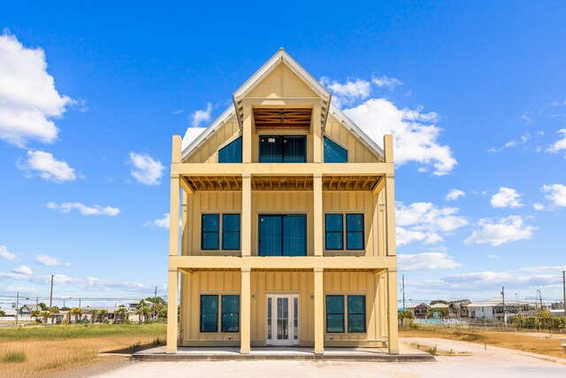 back of house featuring french doors and a balcony