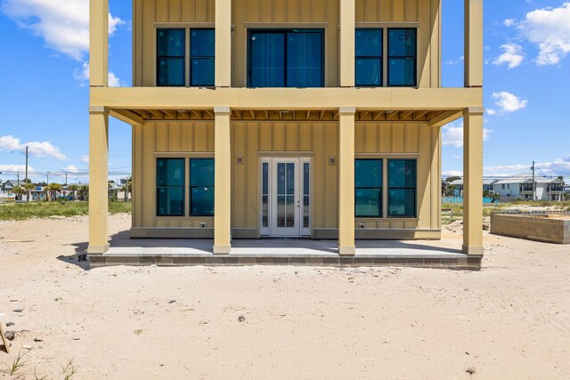 rear view of property with french doors