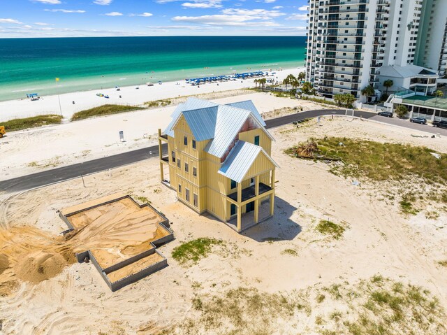 bird's eye view featuring a beach view and a water view