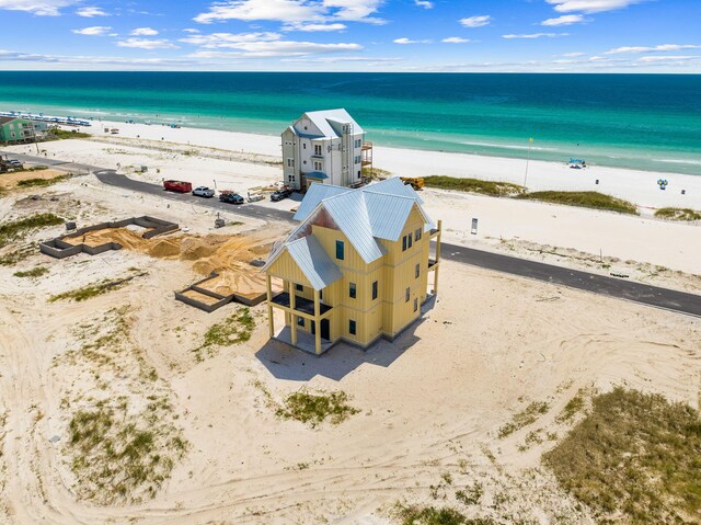 bird's eye view featuring a beach view and a water view