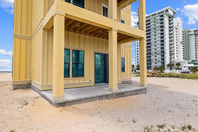 view of side of home featuring a balcony