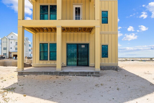 back of property with a balcony