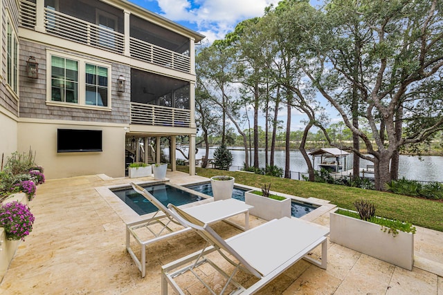 view of terrace with a water view and a balcony